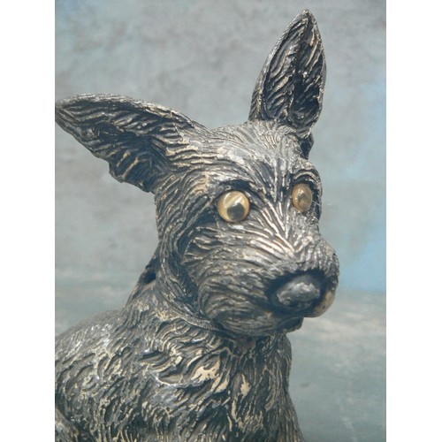 75A - A CIRCA 1920'A SPELTER SCOTTIE DOG TABLE LIGHTER WITH GLASS EYES - 17CM H