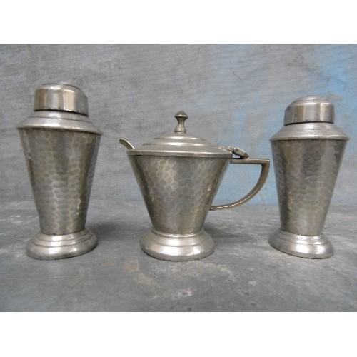 143 - ART DECO HAMMERED PEWTER CRUET SET - ARGENT PEWTER. THE MUSTARD WITH BLUE GLASS LINING