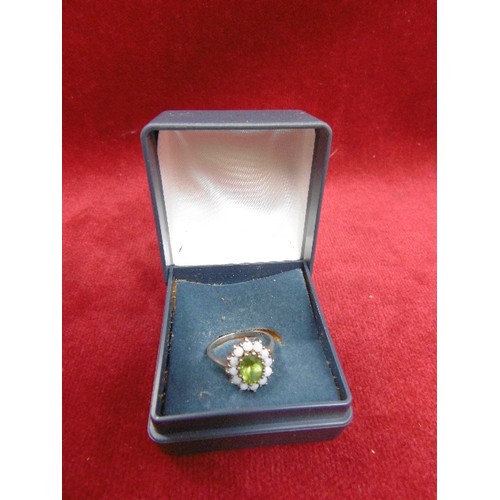 63 - A RING OF PERIDOT AND 12 FIRE OPALS ALL SET IN SILVER THE OPALS ARE VERY BRIGHT WITH  IRIDESCENT RED... 