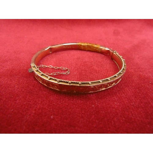 108 - A 9ct GOLD BANGLE BRACELET WITH SAFETY CHAIN SOME DENTS WEIGHT 8.12g