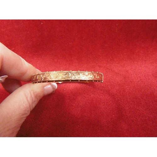 108 - A 9ct GOLD BANGLE BRACELET WITH SAFETY CHAIN SOME DENTS WEIGHT 8.12g