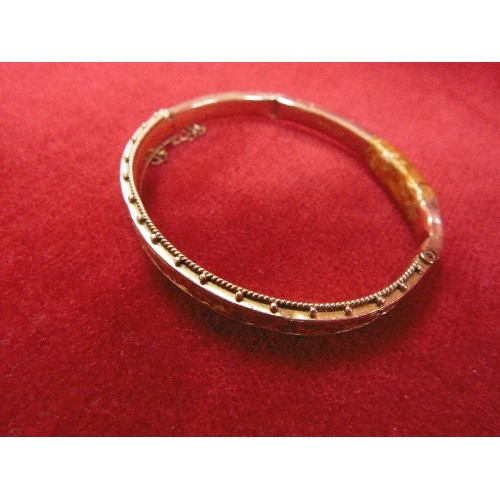 108 - A 9ct GOLD BANGLE BRACELET WITH SAFETY CHAIN SOME DENTS WEIGHT 8.12g