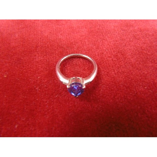 30 - SOLID PLATINUM RING WITH STUNNING PURPLE STONE ARROW CUT 2 BAGUETTE DIAMONDS EACH SIDE CLASSICAL.
WE... 