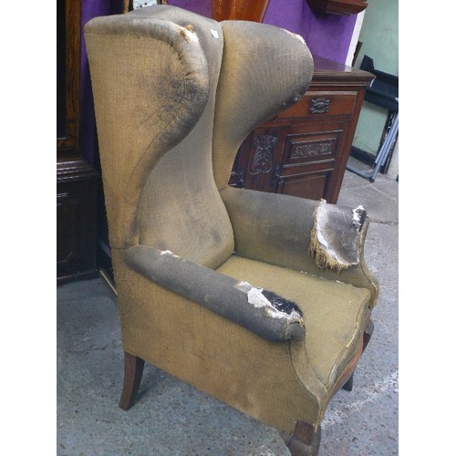 376 - AN ANTIQUE WING ARMCHAIR WITH HIGH BACK AND PRONOUNCED WINGS IN THE 18TH CENTURY STYLE. SOLID MAHOGA... 