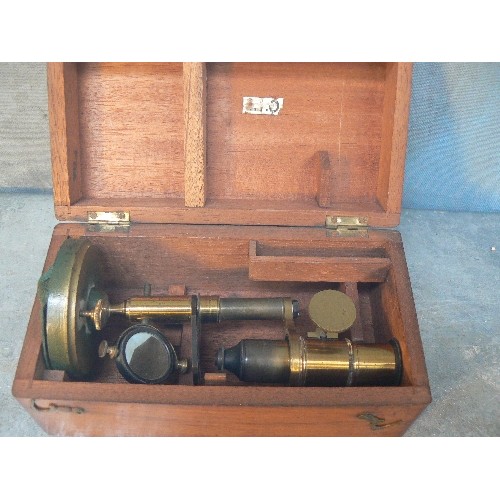 136 - LATE VICTORIAN OR EDWARDIAN STUDENTS MICROSCOPE IN ORIGINAL FITTED MAHOGANY BOX - THE COLUMN TILTS O... 