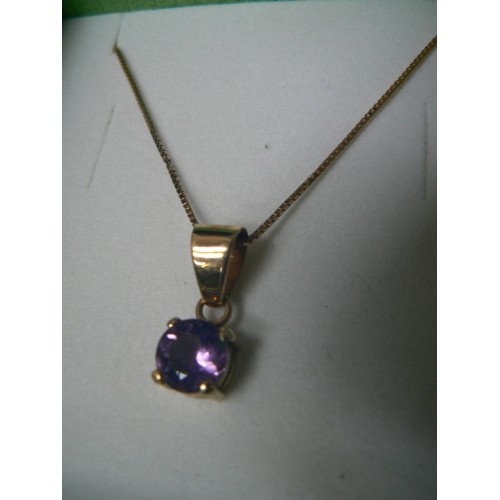 110 - A PENDANT OF 18ct GOLD & AMETHYST, WEIGHT 2.09g THE CHAIN IS 9ct GOLD AND 16 INCHES LONG  CHAIN 1.79... 