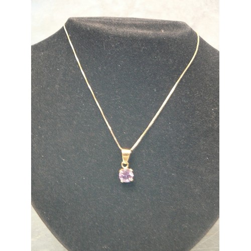 110 - A PENDANT OF 18ct GOLD & AMETHYST, WEIGHT 2.09g THE CHAIN IS 9ct GOLD AND 16 INCHES LONG  CHAIN 1.79... 