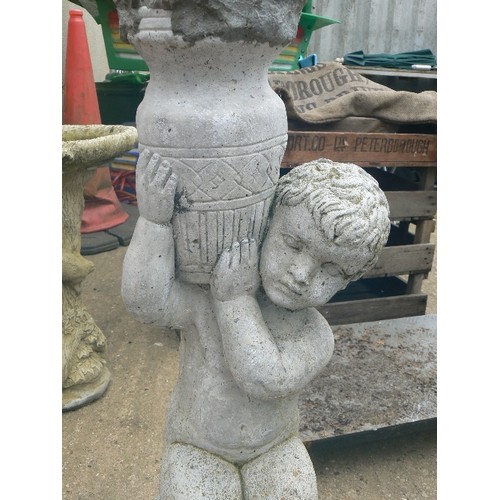 413 - SMALL SIMULATED STONE BIRD BATH ON A CHERUB STAND