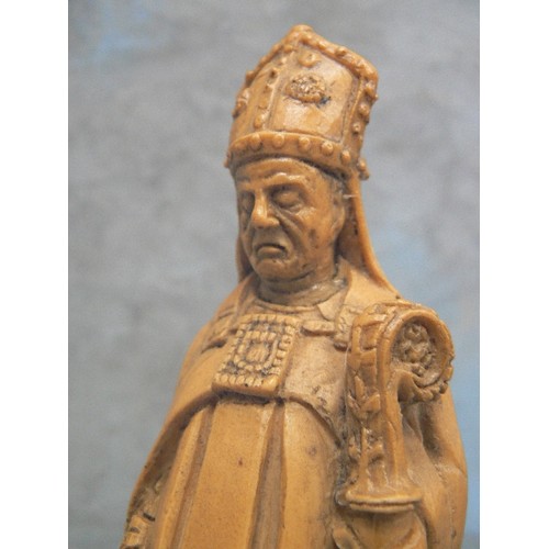 232 - AN UNUSUAL RESIN FIGURE OF A BISHOP WITH A DRAGON AT HIS FEET - 18CM