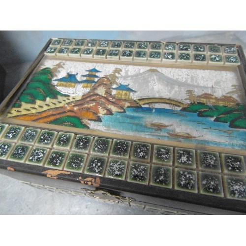 234A - TWO MID CENTURY MUSICAL JEWELLERY BOXES, ONE A JAPANESE MUSICAL BOX WITH FOIL SCENE TO LID AND TILE ... 