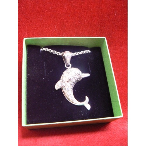 115 - A HEAVY SOLID SILVER DOLPHIN PENDANT ADORNED WITH WHITE STONES ON A SILVER 20