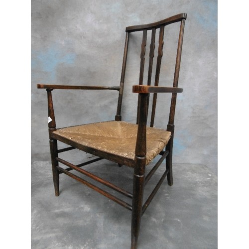 430A - A LATE 19TH CENTURY ARTS AND CRAFTS RUSH SEATED CHAIR WITH SHAPED BACK SPLATS - IN THE STYLE OF A MO... 