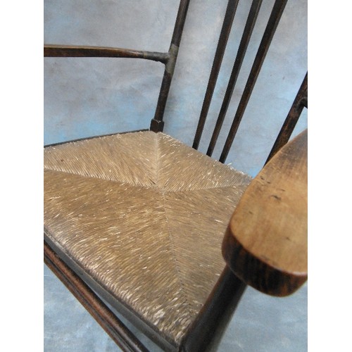 430A - A LATE 19TH CENTURY ARTS AND CRAFTS RUSH SEATED CHAIR WITH SHAPED BACK SPLATS - IN THE STYLE OF A MO... 