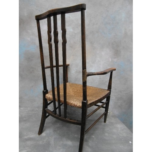 430A - A LATE 19TH CENTURY ARTS AND CRAFTS RUSH SEATED CHAIR WITH SHAPED BACK SPLATS - IN THE STYLE OF A MO... 