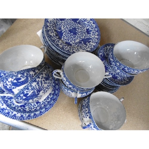 200B - A FINE JAPANESE EGGSHELL PORCELAIN TEASET IN BLUE AND WHITE PHOENIX DESIGN - 39 PIECES - CIRCA 1920