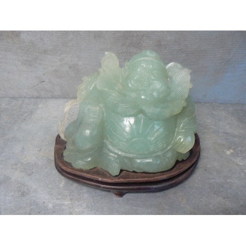 203A - LARGE CHINESE CARVED JADE IMMORTAL FIGURE WITH FLOWING BEARD AND SUNBURST CARVING TO BELLY - ON A WO... 