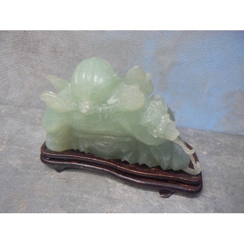 203A - LARGE CHINESE CARVED JADE IMMORTAL FIGURE WITH FLOWING BEARD AND SUNBURST CARVING TO BELLY - ON A WO... 