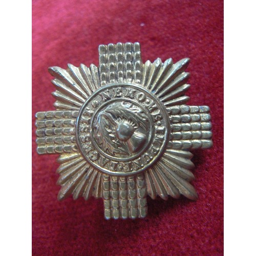 105 - A SCOTTISH MILITARY CAP BADGE 