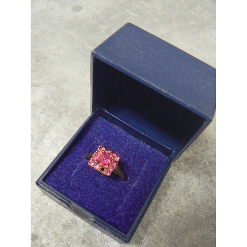 92 - A VINTAGE RUBY AND 9ct GOLD RING MAIN STONE IS 6mm 1.3ct WITH 11 SMALLER STONES AROUND IT WEIGHT 2.3... 