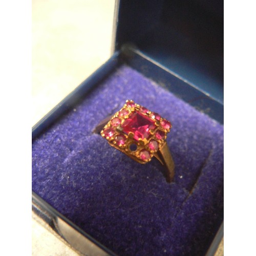 92 - A VINTAGE RUBY AND 9ct GOLD RING MAIN STONE IS 6mm 1.3ct WITH 11 SMALLER STONES AROUND IT WEIGHT 2.3... 