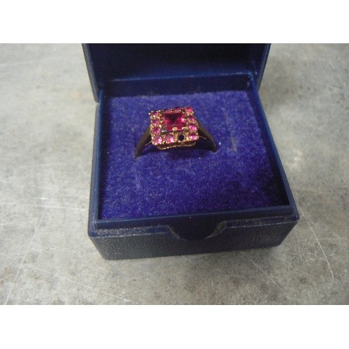 92 - A VINTAGE RUBY AND 9ct GOLD RING MAIN STONE IS 6mm 1.3ct WITH 11 SMALLER STONES AROUND IT WEIGHT 2.3... 