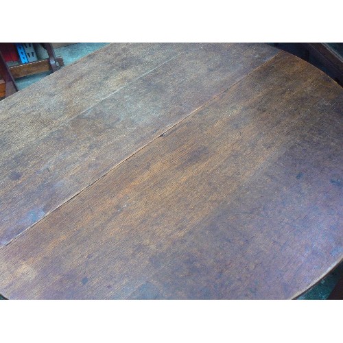 397 - GEORGIAN OAK DROP LEAF DINING TABLE, OVAL SHAPE. WITH LATER CASTORS ADDED