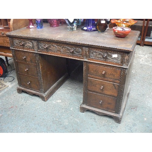 420 - EARLY 20TH CENTURY OAK PEDESTAL DESK WITH CARVING TO THE TOP DRAWERS