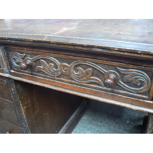 420 - EARLY 20TH CENTURY OAK PEDESTAL DESK WITH CARVING TO THE TOP DRAWERS