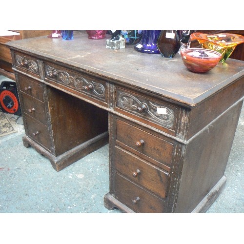 420 - EARLY 20TH CENTURY OAK PEDESTAL DESK WITH CARVING TO THE TOP DRAWERS