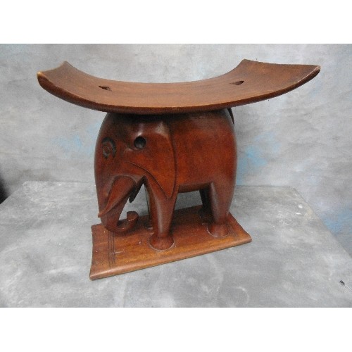 223B - EARLY 20TH CENTURY AFRICAN ASHANTI ELEPHANT STOOL. IN SOLID HARDWOOD. DAMAGE TO END OF ONE TUSK, SEE... 