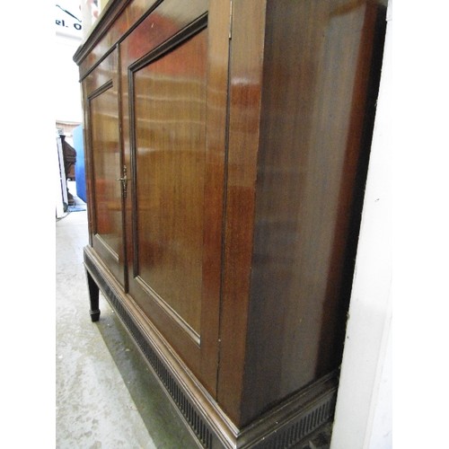 430 - AN EARLY 20TH CENTURY MAHOGANY CABINET WITH PANELLED DOORS, ON FOUR TAPERED LEGS WITH SPADE FEET. 11... 