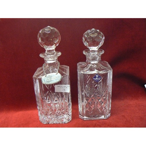 73 - A GOOD QUALITY NEAR PAIR OF CUT GLASS CRYSTAL DECANTERS, ONE WITH A SILVER PLATED 