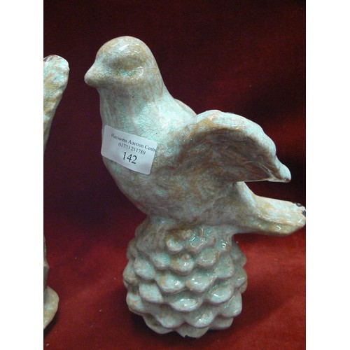 142 - PAIR OF GLAZED BIRD ORNAMENTS IN A PALE DUCK-EGG COLOUR.