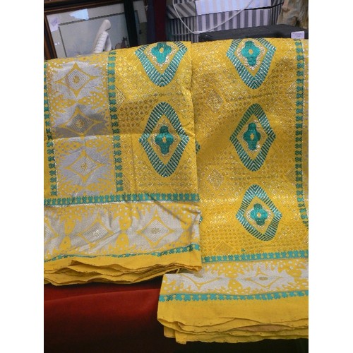 384 - AFRICAN FABRIC IN CITRUS YELLOW, EMERALD AND WHITE, WITH GOLD THREAD RUNNING THROUGH PATTERN.