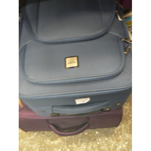 369 - 3 X SUITCASES IN GOOD CLEAN CONDITION. A PURPLE, A BLUE AND A BLACK.