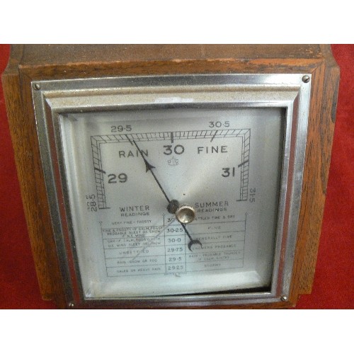 399 - ART DECO BAROMETER WITH OAK SURROUND.