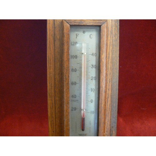 399 - ART DECO BAROMETER WITH OAK SURROUND.