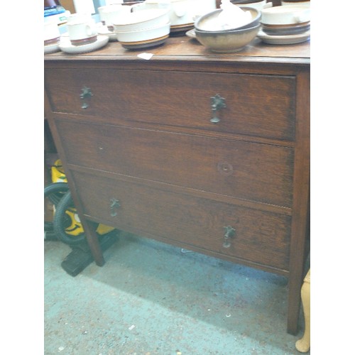 428 - ANTIQUE 3 DRAWER CHEST. OAK. DROP HANDLES [1 OF WHICH IS IN THE DRAWER]