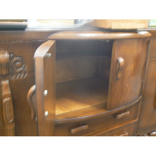 473 - HEAVY VINTAGE SIDEBOARD WITH CENTRAL BOW FRONTED DRINKS SECTION.