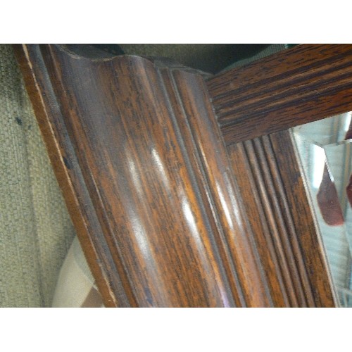 594 - VINTAGE OAK FRAMED WALL MIRROR. BEVELLED GLASS.