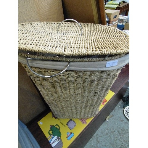 538 - LINED WICKER LAUNDRY BASKET, CONTAINS WICKER PAPER BASKET, SHOWER MAT AND OTHER HOUSEHOLD.