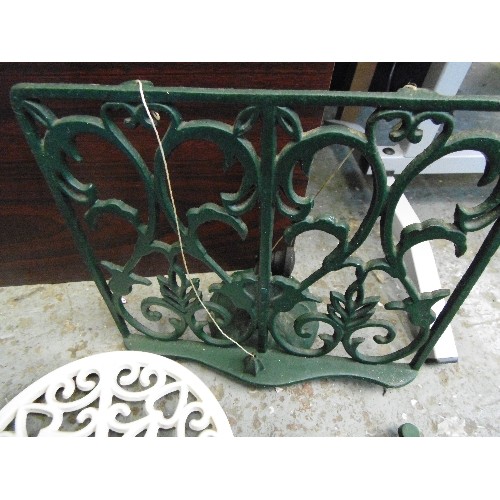 535 - CAST IRON COOK BOOK STAND AND 2 TRIVETS.