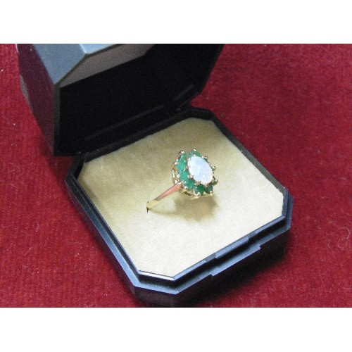 48 - A VINTAGE 9ct GOLD DRESS TO IMPRESS RING GOOD SIZE FIRE OPAL ( BLUE GREEN ORANGE) SURROUNDED BY GREE... 