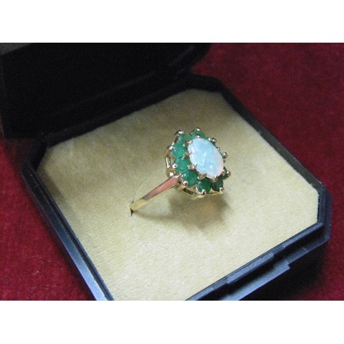 48 - A VINTAGE 9ct GOLD DRESS TO IMPRESS RING GOOD SIZE FIRE OPAL ( BLUE GREEN ORANGE) SURROUNDED BY GREE... 