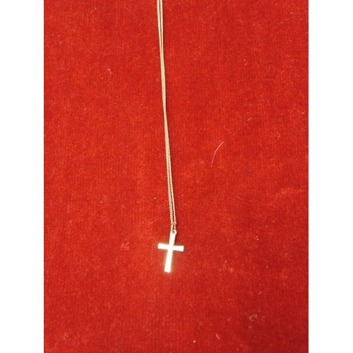 64 - A SILVER CROSS AND CHAIN WITH A LETTER T PENDANT