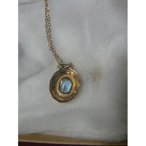 60 - A 9ct GOLD PENDANT WITH LIGHT BLUE STONE ON A  16 INCH 9ct GOLD CHAIN WEIGHT 3.56gr