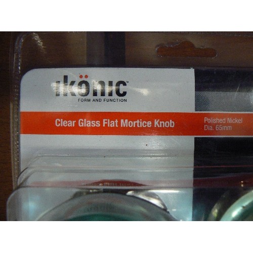 227 - 2 SETS OF CLEAR GLASS FLAT MORTICE DOORKNOBS. POLISHED NICKEL STEM. APPEAR NEW BUT 1 PACK HAS BEEN O... 