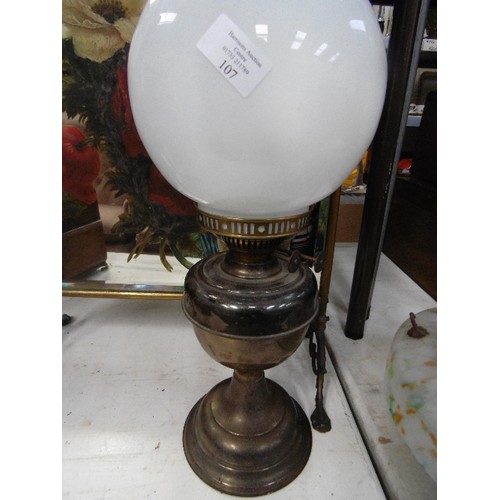 107 - LARGE VINTAGE OIL LAMP, COMPLETE WITH MILK GLASS GLOBE AND GLASS CHIMNEY.