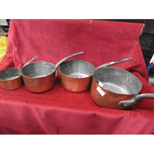 112 - SET OF 4 GRADUATED VINTAGE COPPER SAUCEPANS WITH IRON HANDLES.