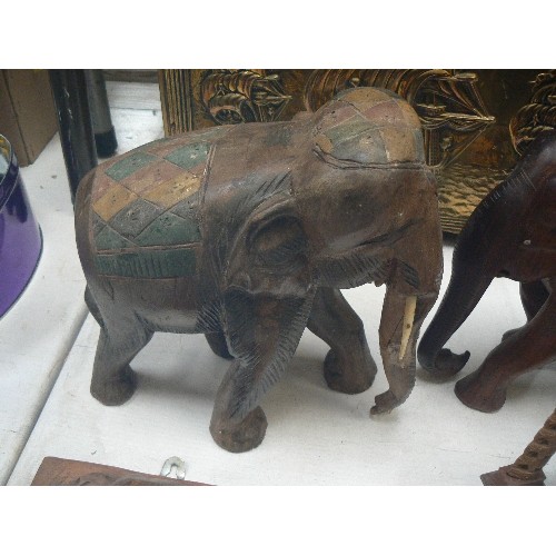 126 - WOODEN ELEPHANT COLLECTION. VINTAGE. INCLUDES 2 LARGE CARVED, 1 SMALLER, 1 BOOKEND, TINY CARVED ELEP... 